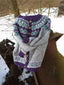 The grey and purple Norwegian knit cardigan shown flat
