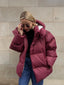 Women's oversized hooded puffer coat in burgundy red