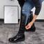 Black over the knee snow boots with bow detail