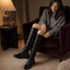 Snow boots worn with a knit dress