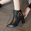 Black pointed toe ankle boots worn with jeans