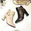 Beige and black pointed toe ankle boots shown together