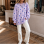 Women's Polka Dot Sweatshirt with Crisscross Ribbon Tie Neckline in lavender