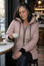 Quilted jacket worn with the hood up