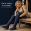 Pulling on the tall quilted winter boots
