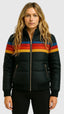 Black rainbow stripe puffer jacket worn with jeans