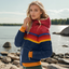 Navy blue retro stripe puffer jacket worn with the hood up