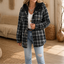 Women's sherpa lined plaid flannel shacket in black