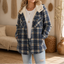 Plaid flannel shacket shown in a deep blue check