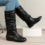 Black slouch boots shown as a pair