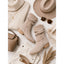 Beige slouch boots styled with knitwear