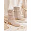 Slouch boots worn with a light outfit