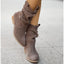 Slouch boots on a stone pavement