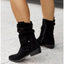 Black slouch boots worn with jeans