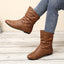 Light brown slouch boots worn with jeans