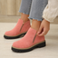 Pulling on the cushioned ankle boots