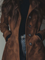 Detail of the buttons on the brown suede look trench coat