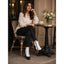 White button boots worn at a cafe table