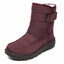Wine red snow boots worn on the foot