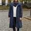 Dark blue rain coat worn outdoors