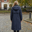 Back view of the dark blue rain coat with the hood up