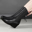 Black wedge mid calf boots shown from the side