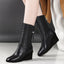 Black wedge mid calf boots worn as a pair