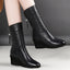 Black wedge mid calf boots shown from the front