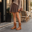 Mid calf combat boots styled with a mini skirt