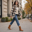 Brown combat boots paired with denim and a check coat